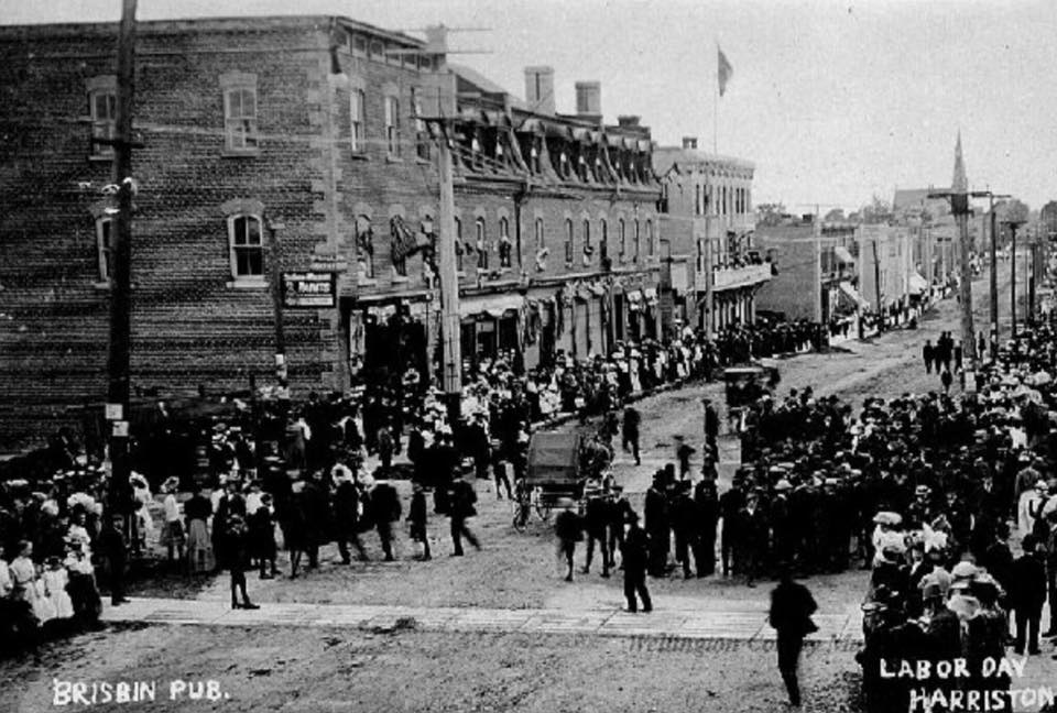 A black and white photo of a labor day parade in harrison