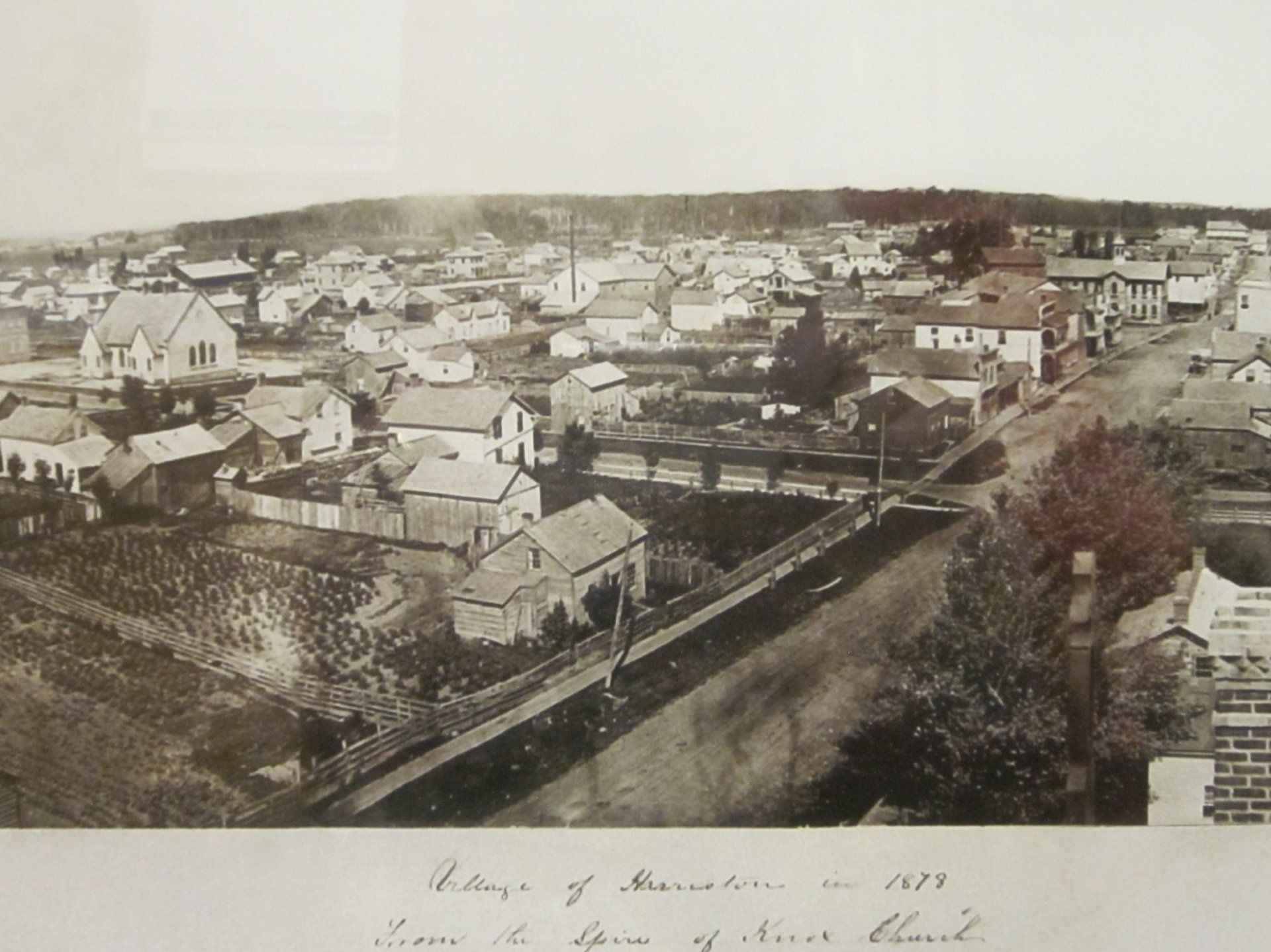 A black and white photo of a small town taken in 1921