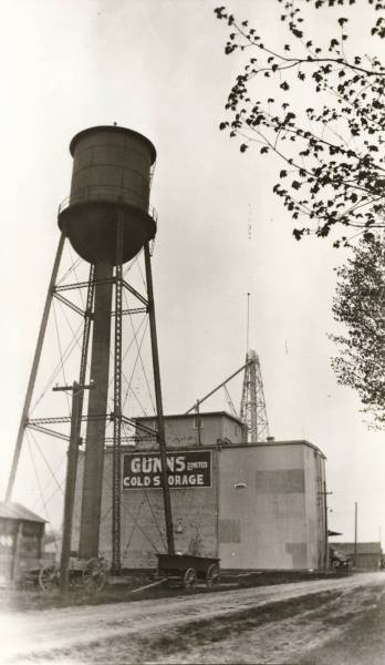 A black and white photo of a water tower