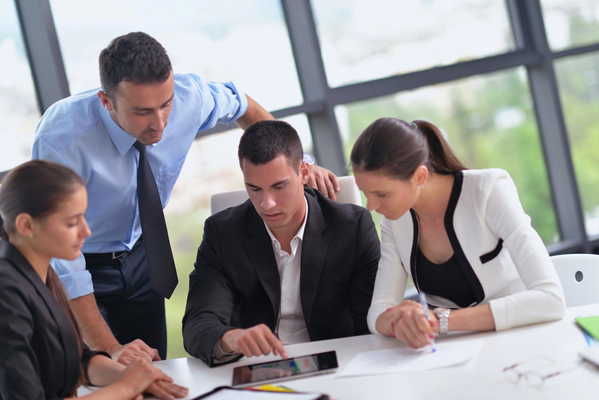 Team Building image showing a group of business people training