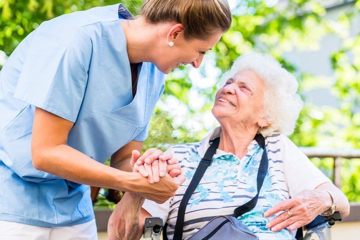 Home Healthcare Worker and Patient Outside