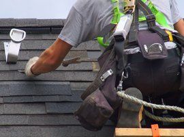 Man Repairing Roof — Jasper, IN — Fleck Roofing