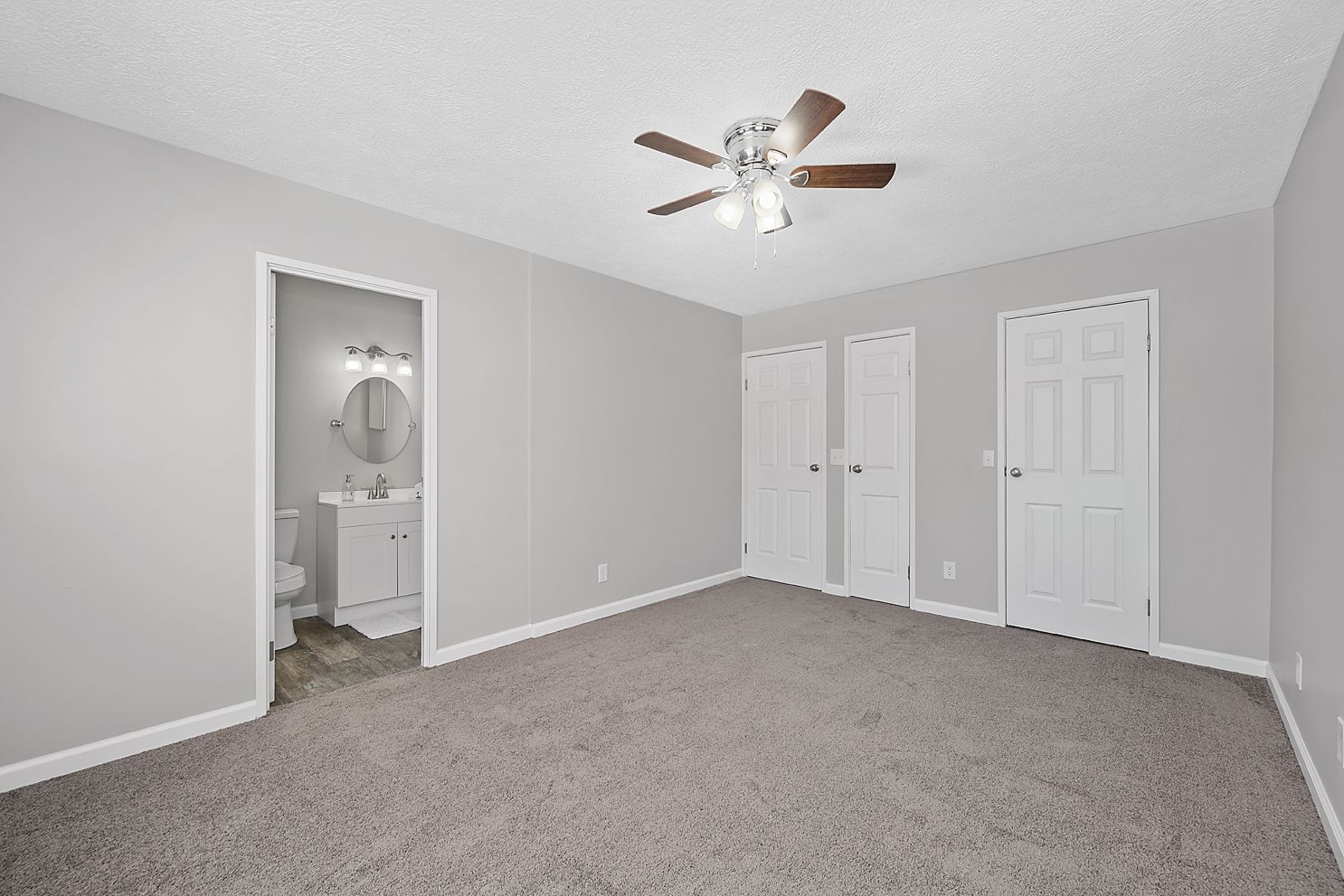Image of a bedroom looking into the bathroom