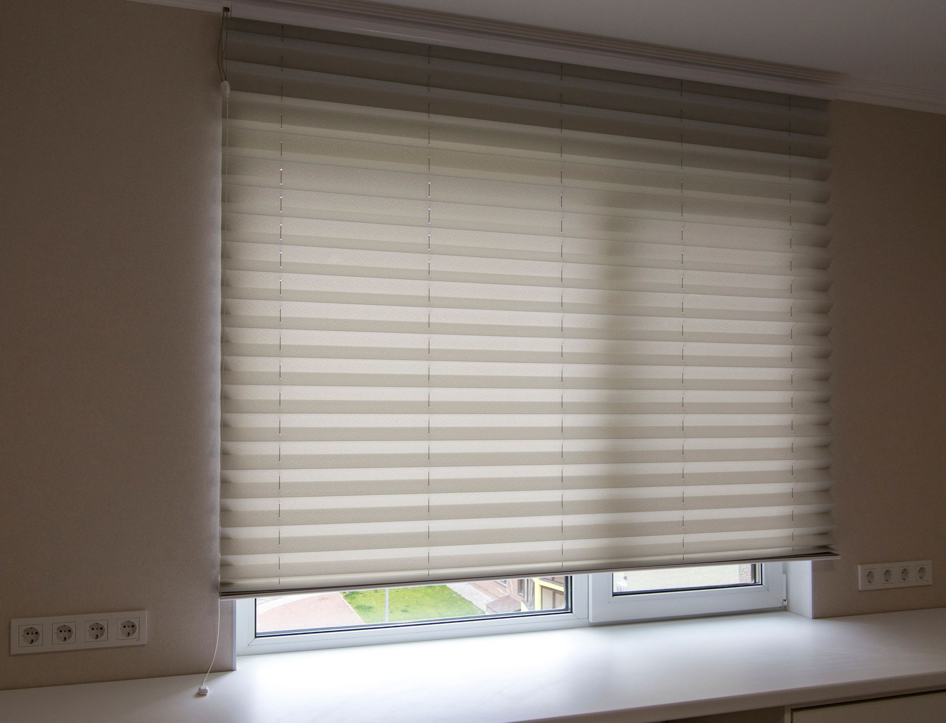 Custom mini window blinds in Floyds Knobs, IN, showcasing pleated blinds in a modern window for ligh