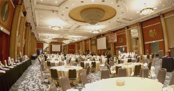 A large room with tables and chairs in it