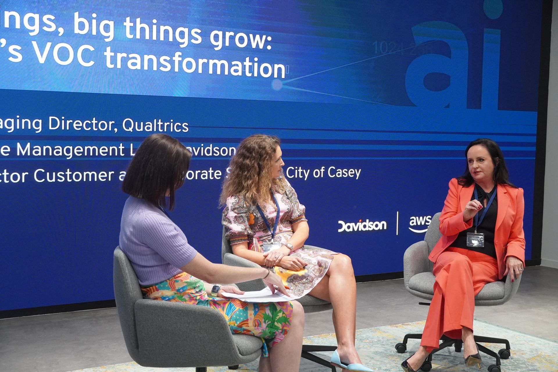 Three women are sitting in front of a screen. LG Innovate AI Summit 2024
