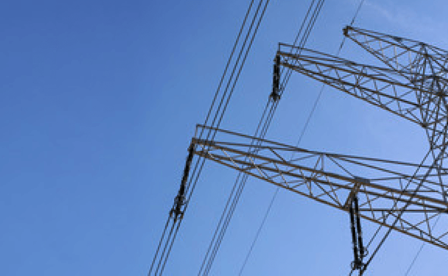 Photo of power lines against a clear blue sky
