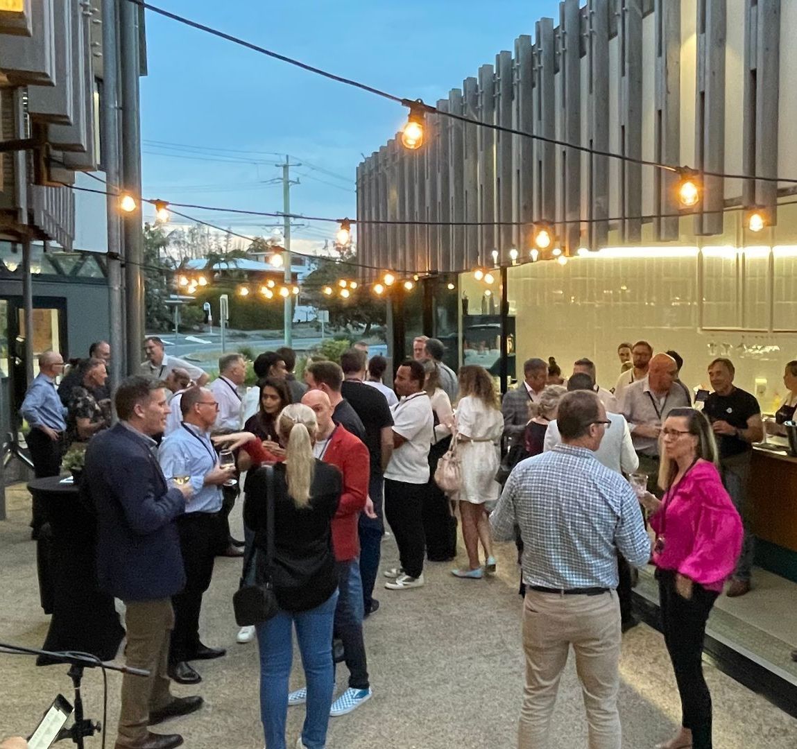 A group of people are standing outside of a building. 2024 LG Innovate AI Summit networking.