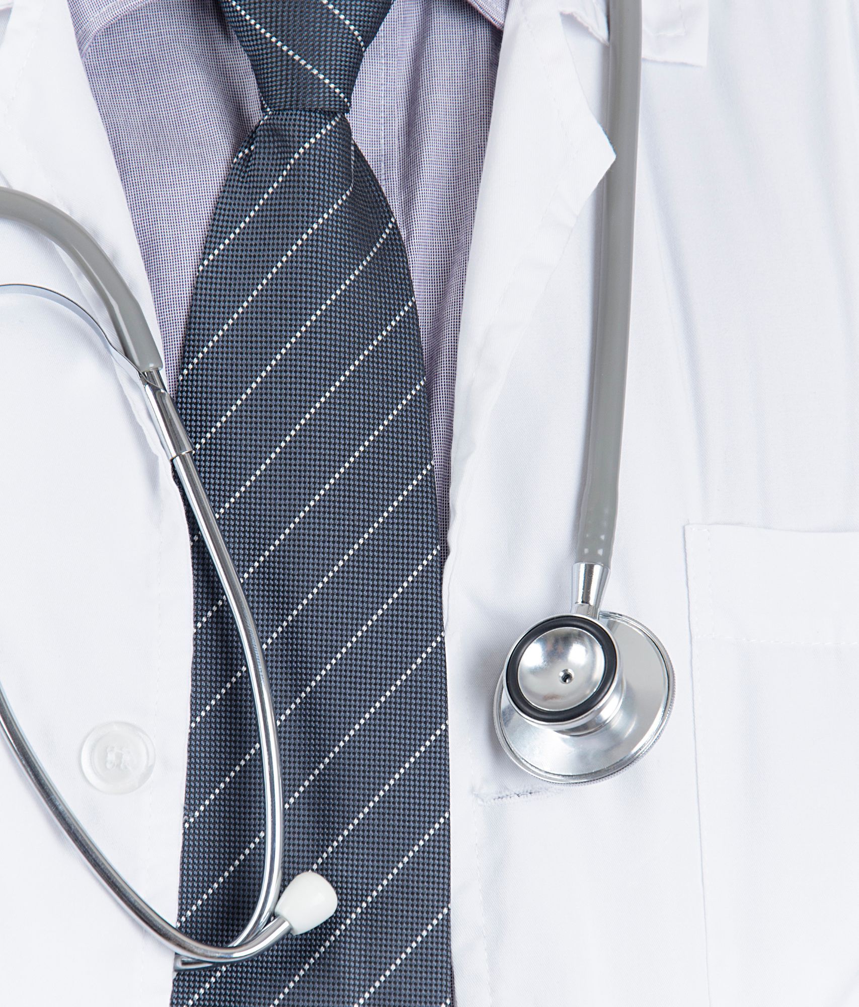 A man with a grey tie, white doctors coat and stethoscope around his neck.
