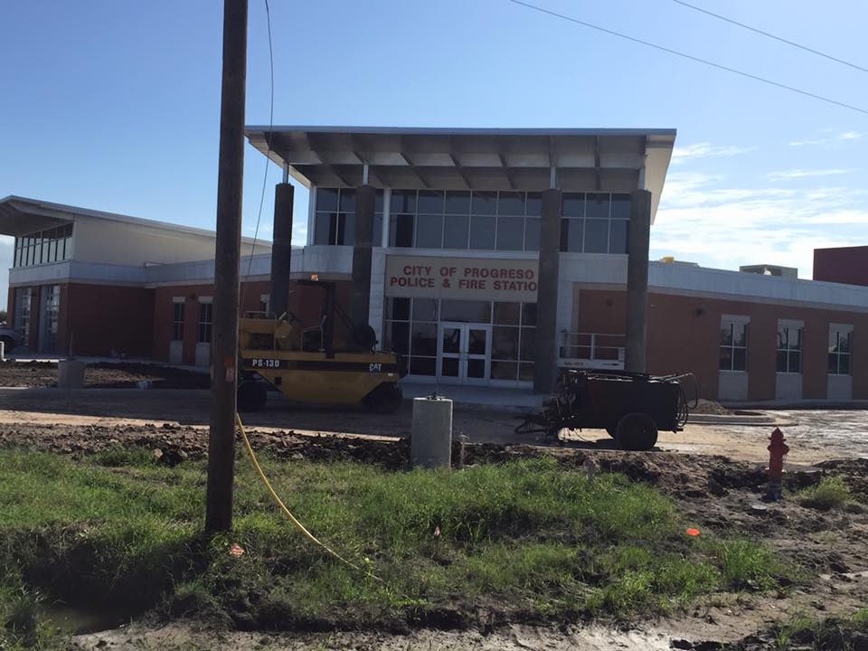 a large building with a sign that says city of houston police & fire station