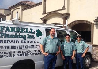 three men are standing in front of a white van that says farrell plumbing inc. repair service