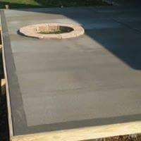 A concrete floor with a hole in the middle of it.