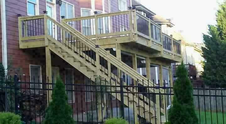 A wooden deck with stairs leading up to it
