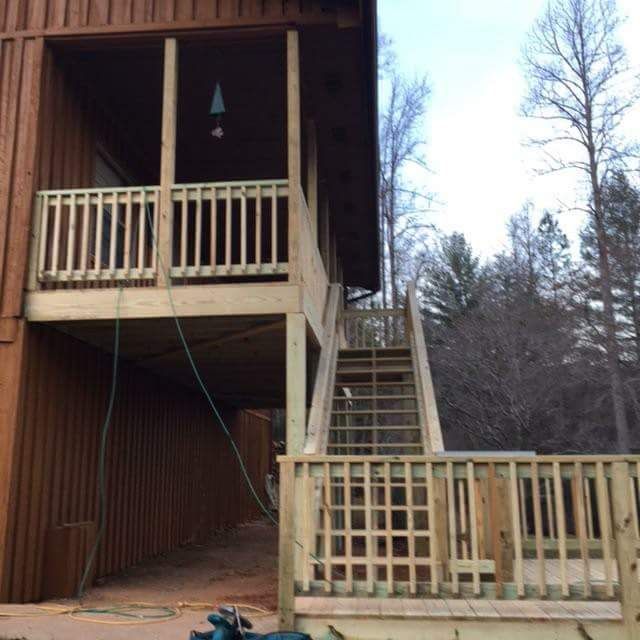 A house with a wooden deck and stairs