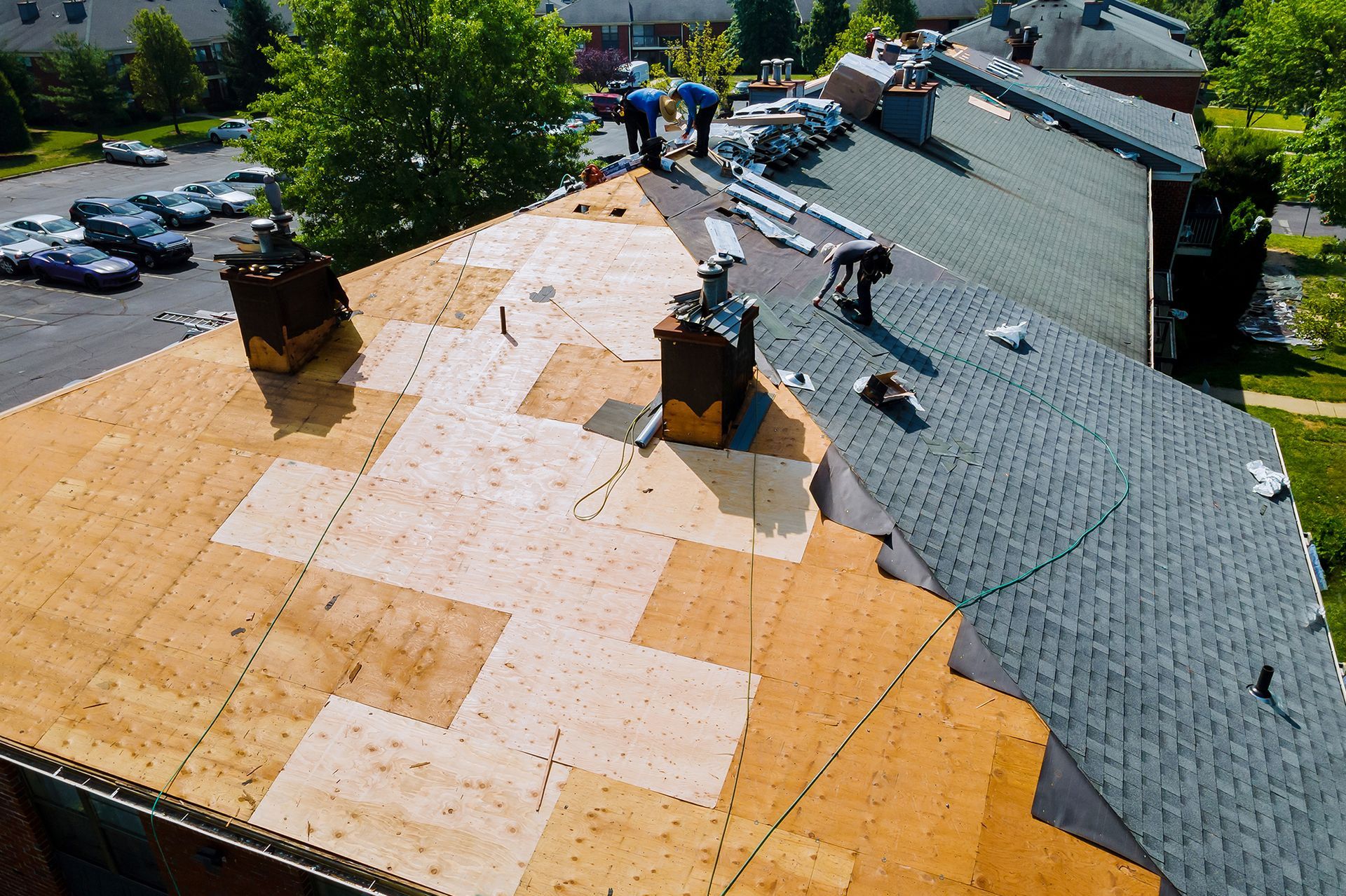 An aerial view of a roof that is being repaired.