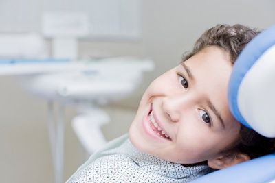 young boy in dentist chair