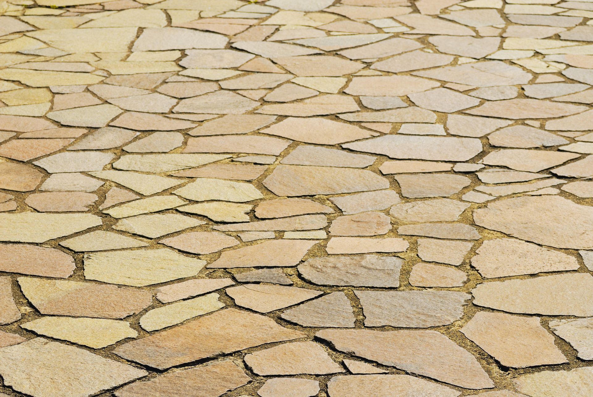 A close up of a stone floor with a geometric pattern