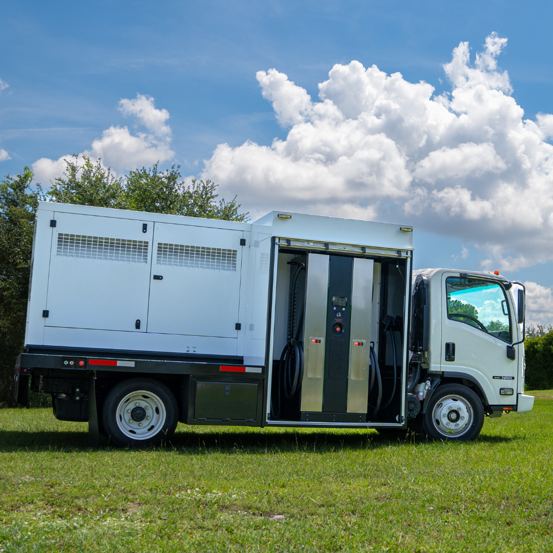 A car is being charged by a truck in a field.