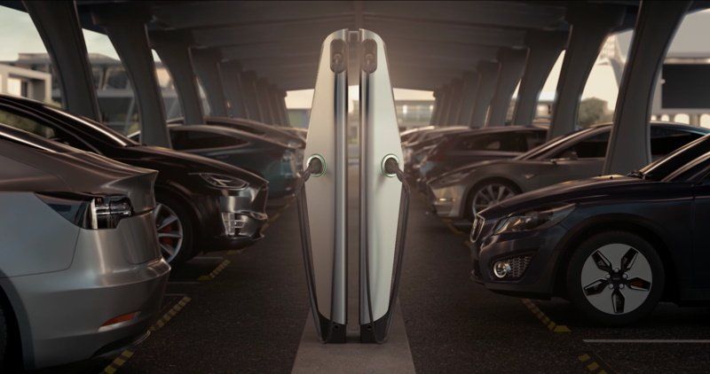 A surfboard is sitting in a parking lot surrounded by cars.