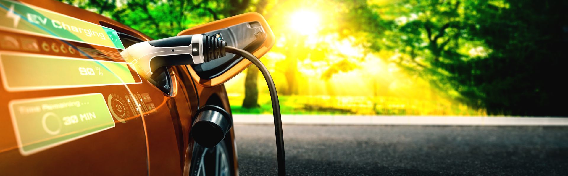 An electric car is being charged on the side of the road.