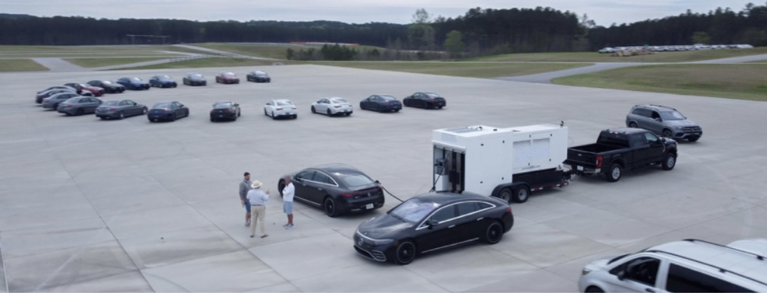 A group of cars are parked in a parking lot.