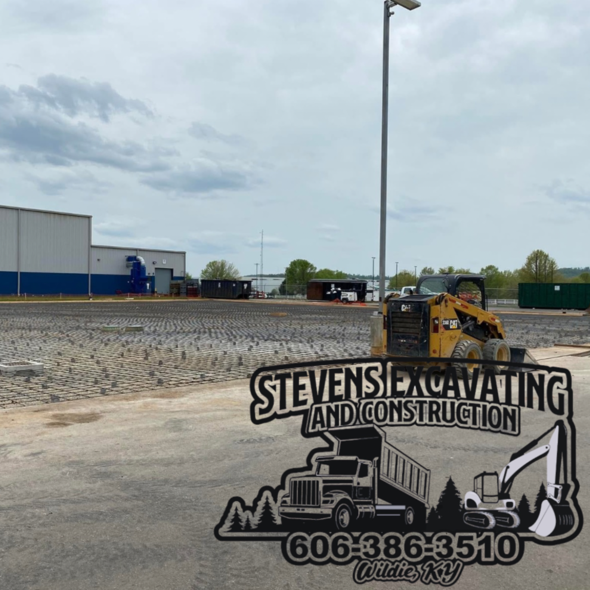 Construction site with machinery; Stevens Excavating logo.