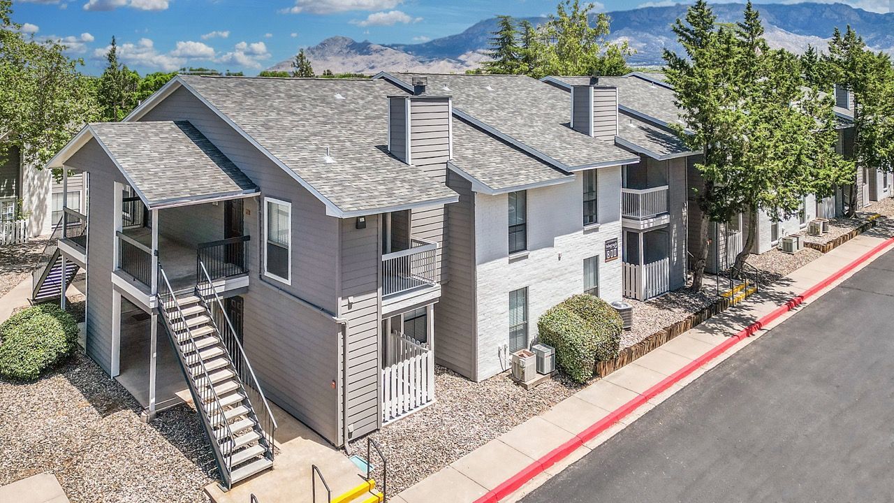 Exterior view of Telegraph Hill community building with stairs, balconies, and a street frontage.