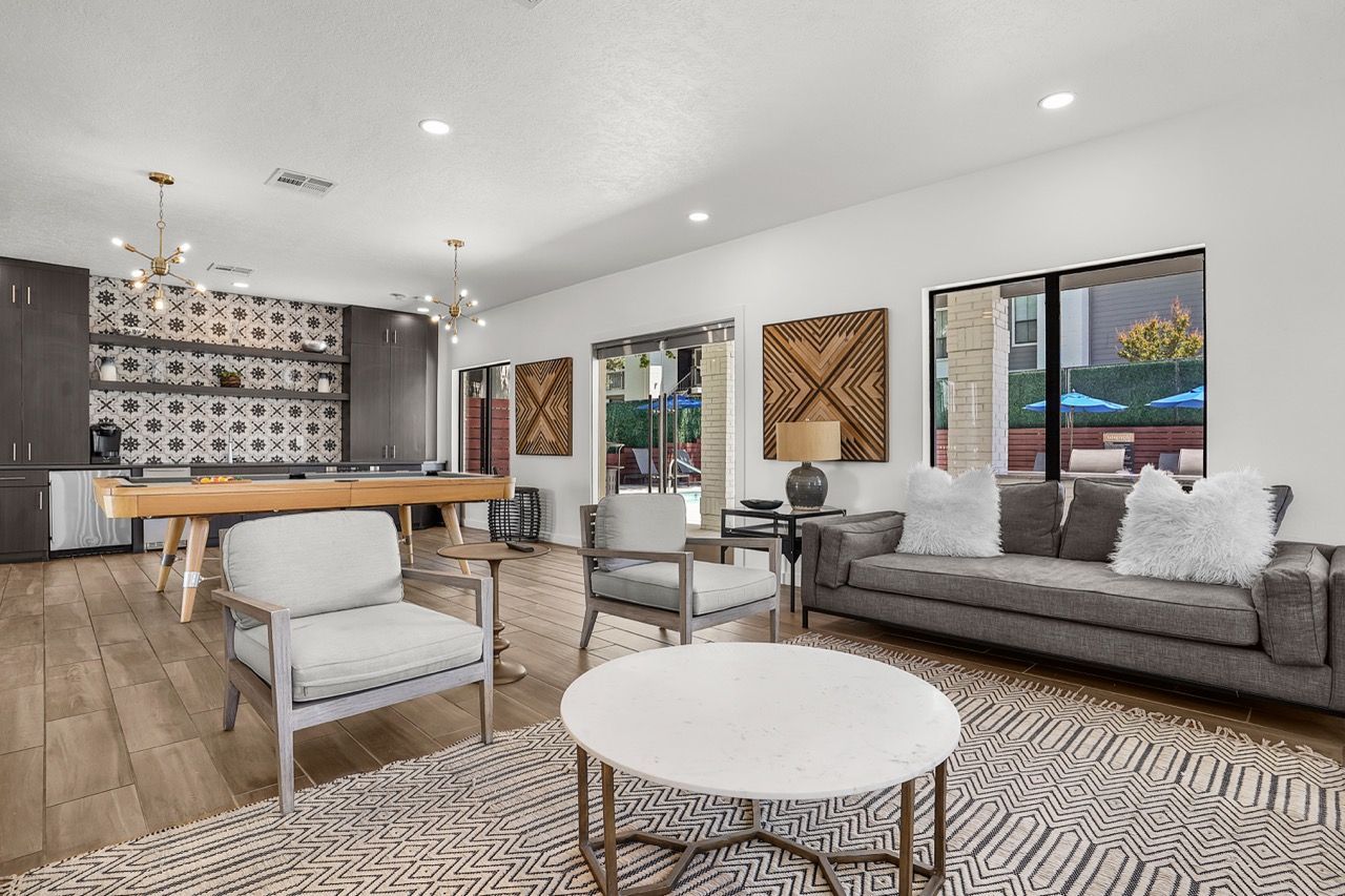 Telegraph Hill  communal lounge with a sofa, two lounge chairs, a kitchenette, and a pool table.