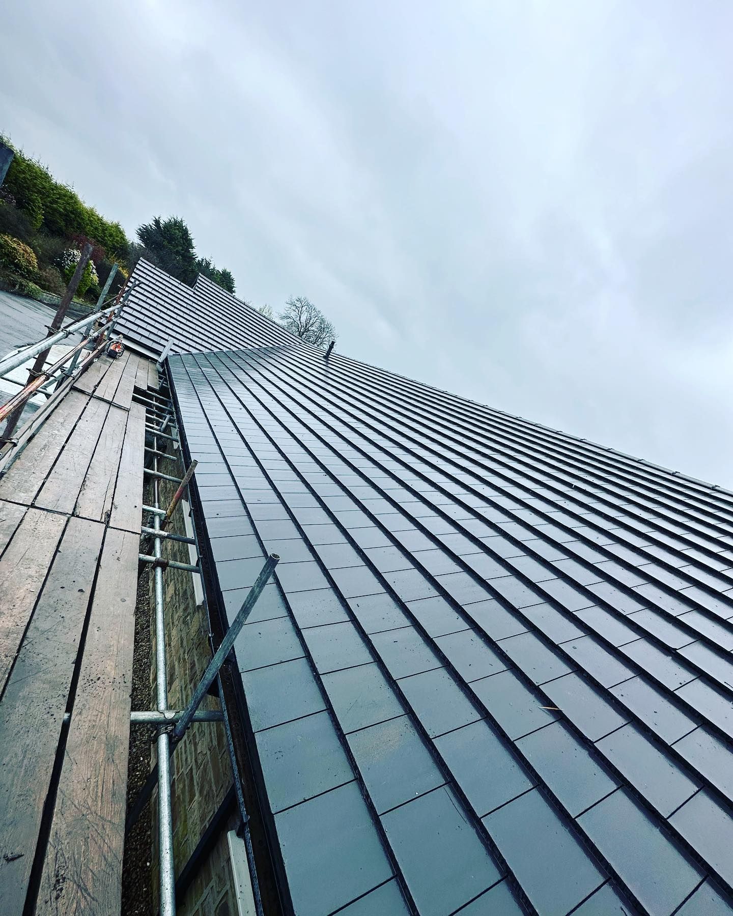 A picture of a slate roof replacement by Hightop roofers Barnsley