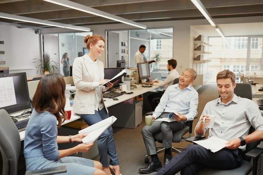 a group of people are having a meeting in an office