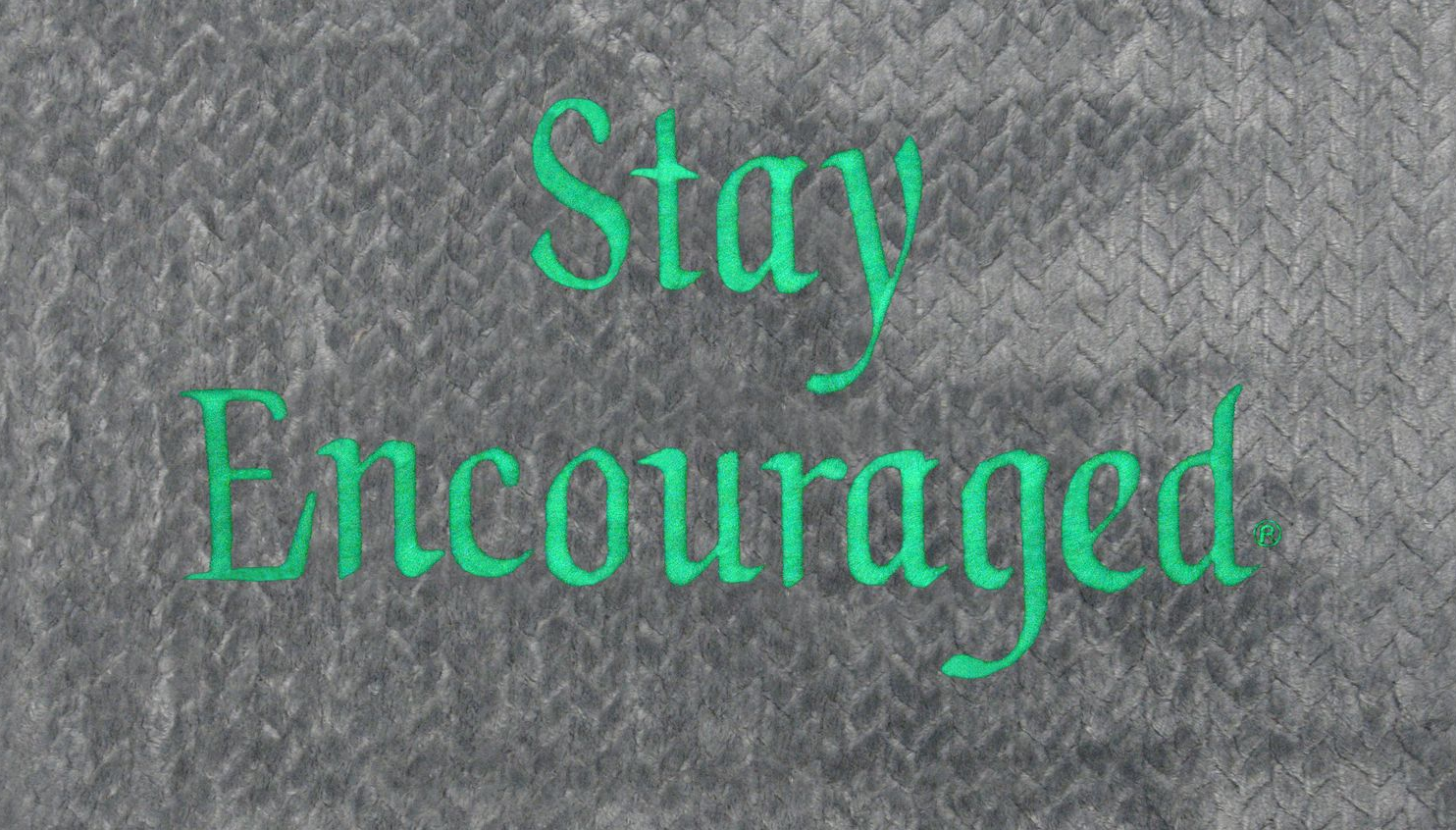 Gray diamond-plate background with the words 