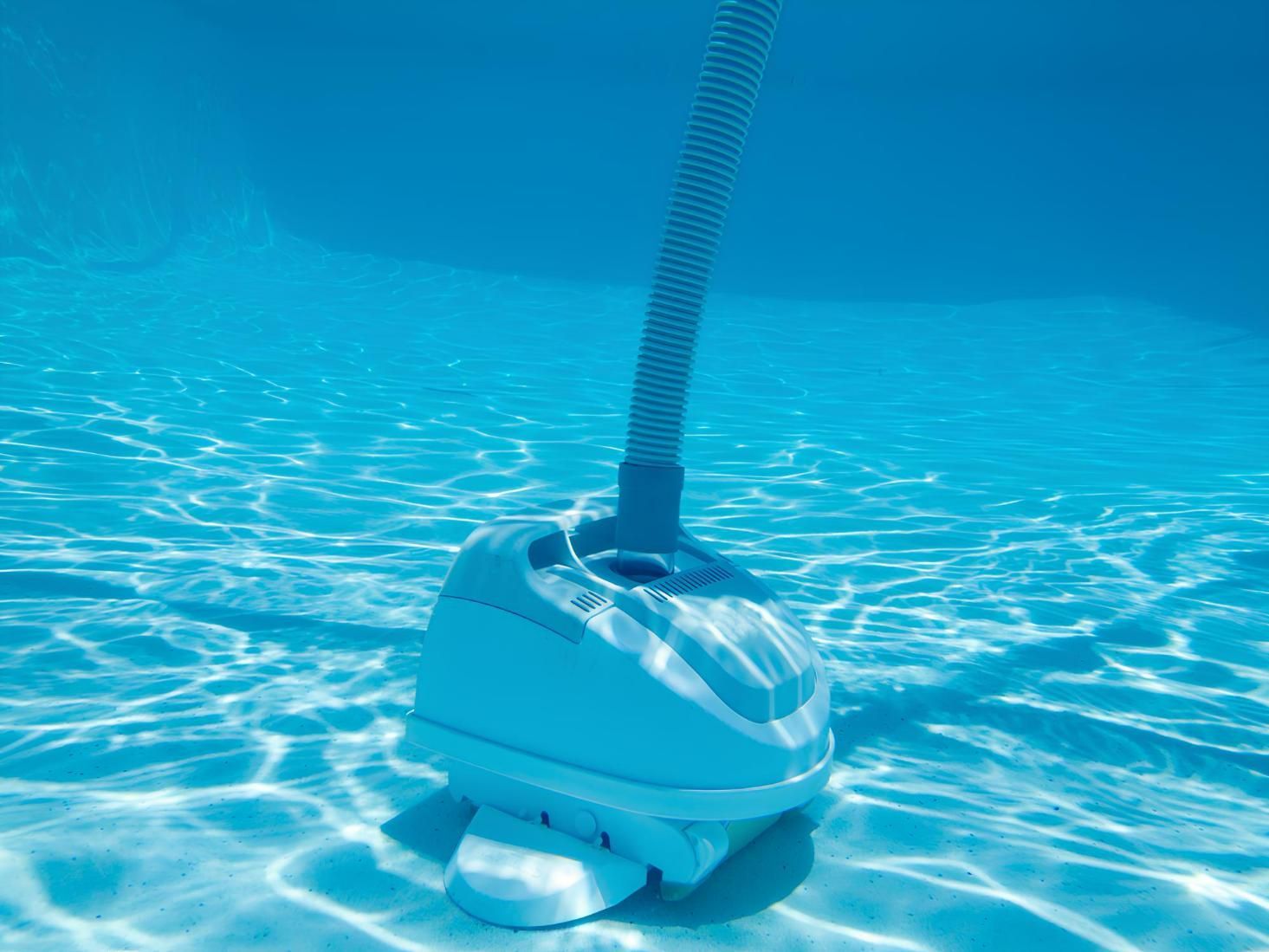 A Vacuum Cleaner Is Floating Underwater in A Swimming Pool — Tweed Coast Pool Care in South Murwillumbah, NSW