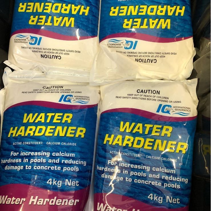 Two Bags of Water Hardener Are Stacked on Top of Each Other — Tweed Coast Pool Care in Burringbar, NSW