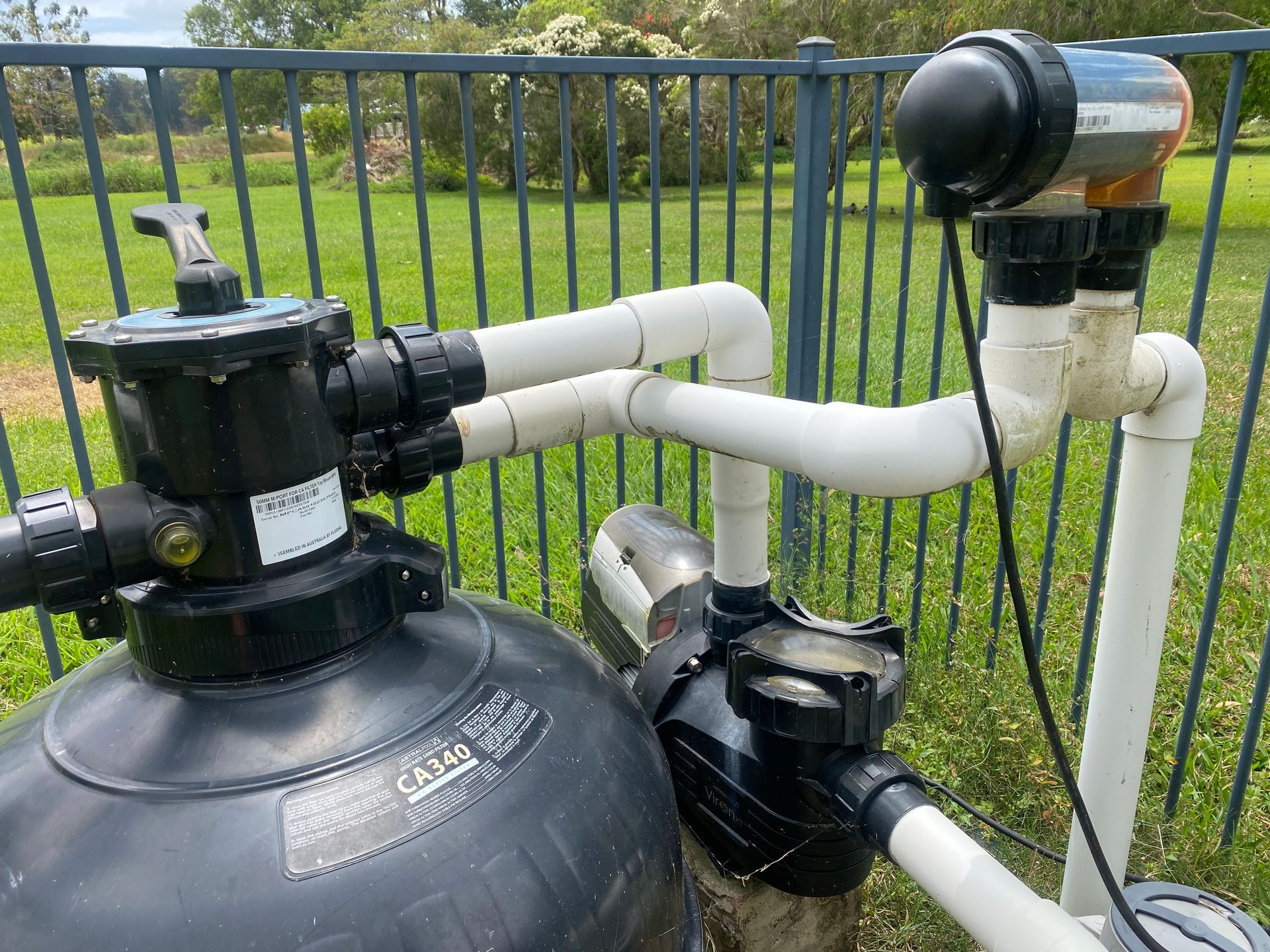 A Person is Working on a Swimming Pool Filter — Tweed Coast Pool Care in South Murwillumbah, NSW