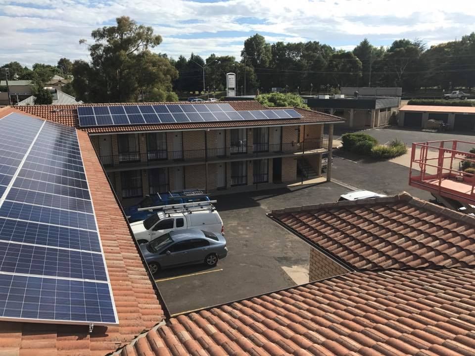 A Building With A Lot Of Solar Panels On The Roof — CJ Electrical & Solar In Nelson Bay, NSW