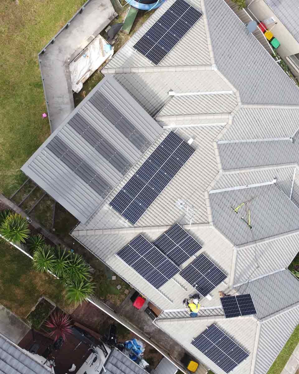 An Aerial View Of A House With Solar Panels On The Roof — CJ Electrical & Solar In Cameron Park, NSW