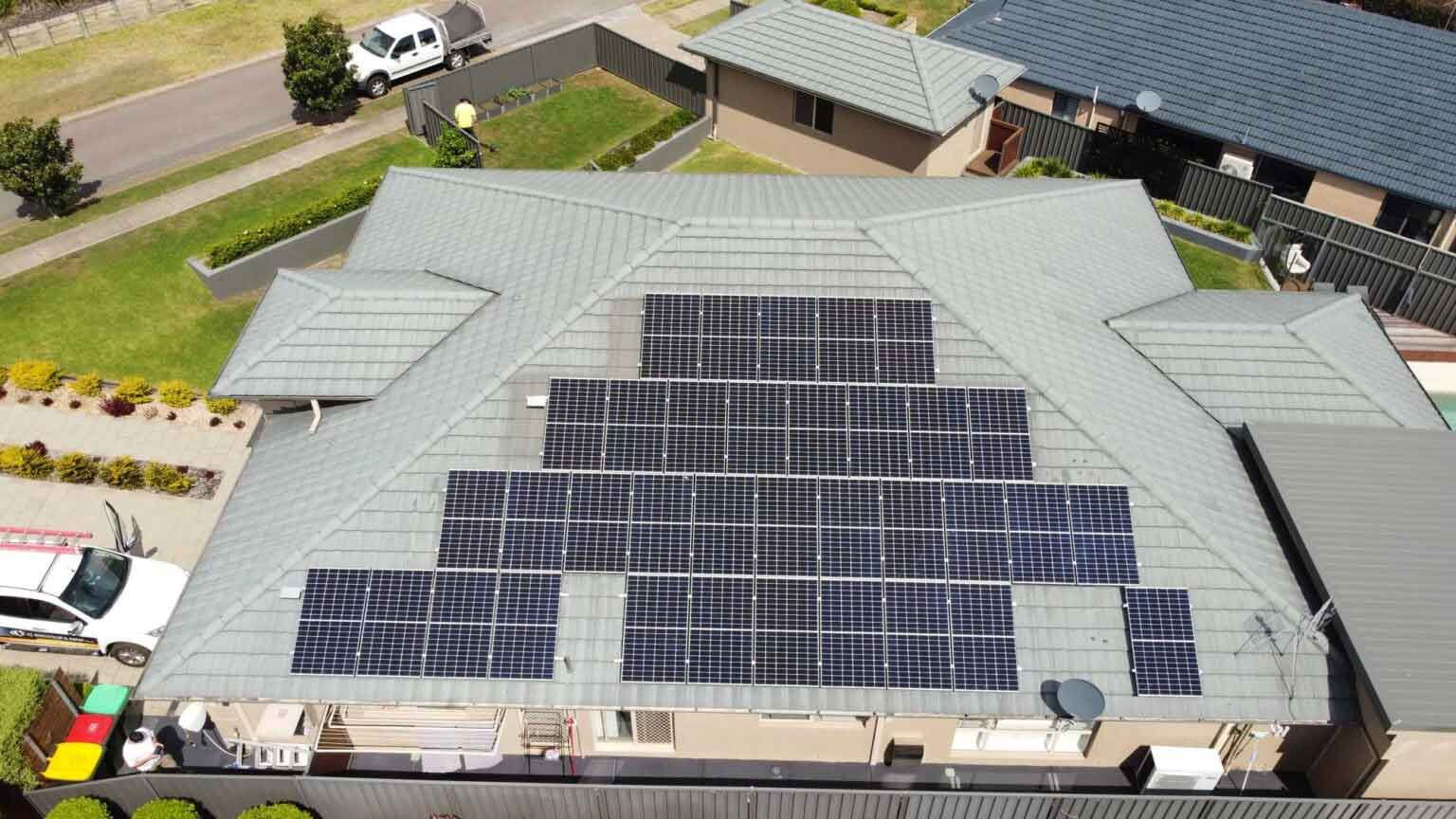 An Aerial View Of A House With Solar Panels On The Roof — CJ Electrical & Solar In Cardiff, NSW