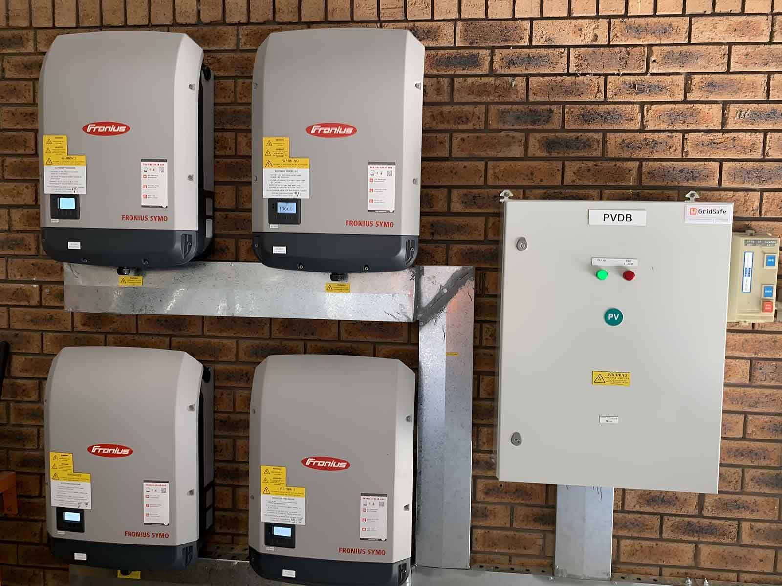 A Row Of Solar Panels Are Mounted To A Brick Wall — CJ Electrical & Solar In Cardiff, NSW