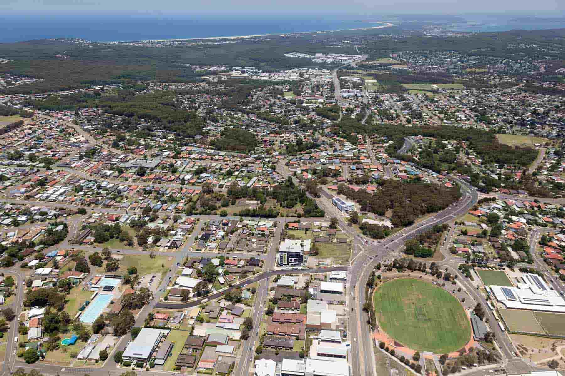 An Aerial View Of A City With A Soccer Field — CJ Electrical & Solar In Charlestown, NSW