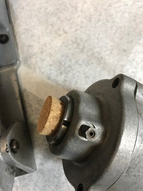 A close up of a metal object with a cork on top of it.