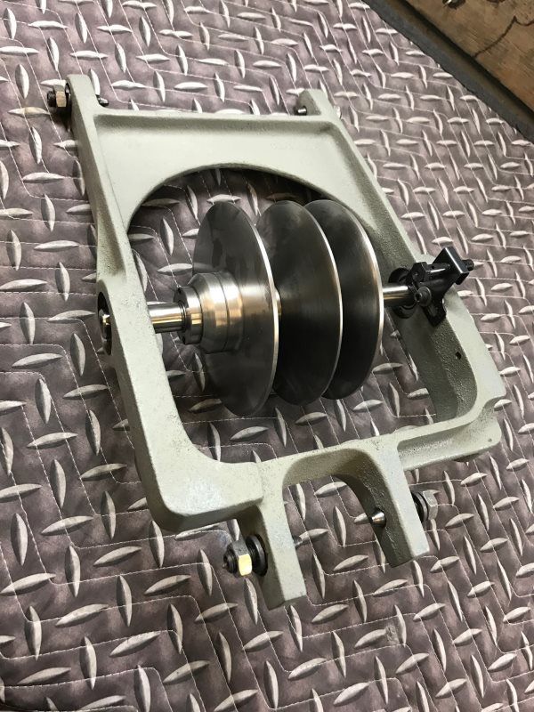 A metal object is sitting on top of a metal surface.