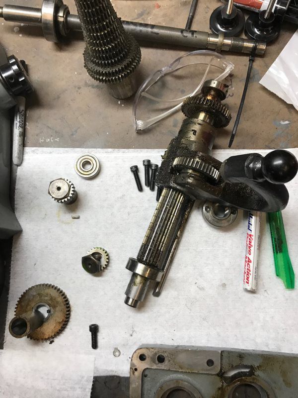 A bunch of pieces of metal are laying on a table