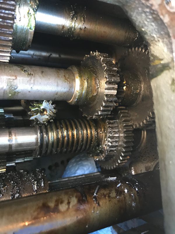 A close up of a machine with gears and shafts.