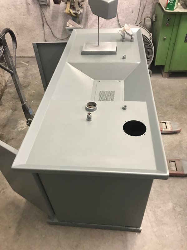A white counter top with a hole in the middle of it.