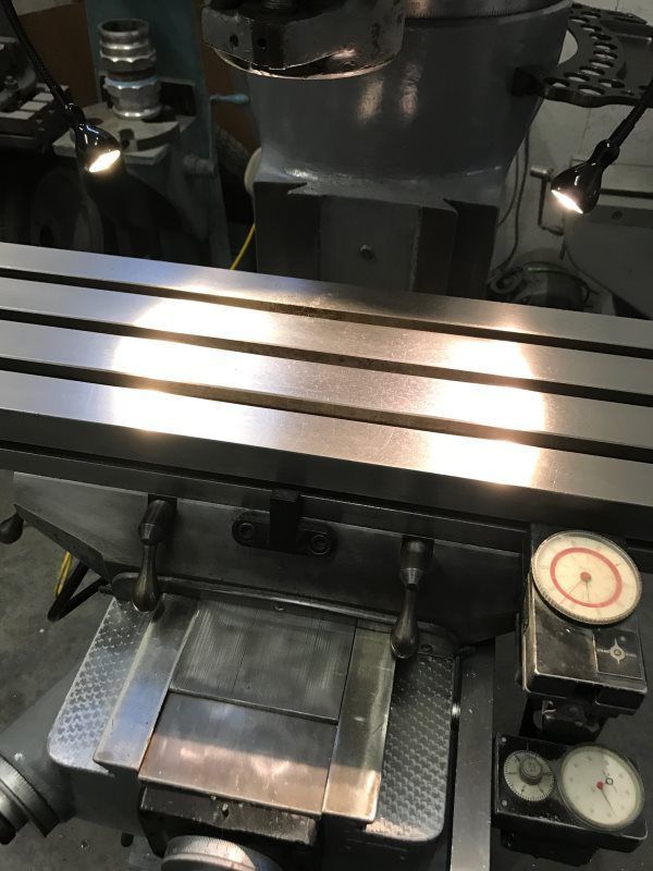 A machine is sitting on a table with a clock on it.