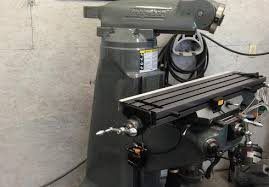 A machine is sitting in a room next to a wall.