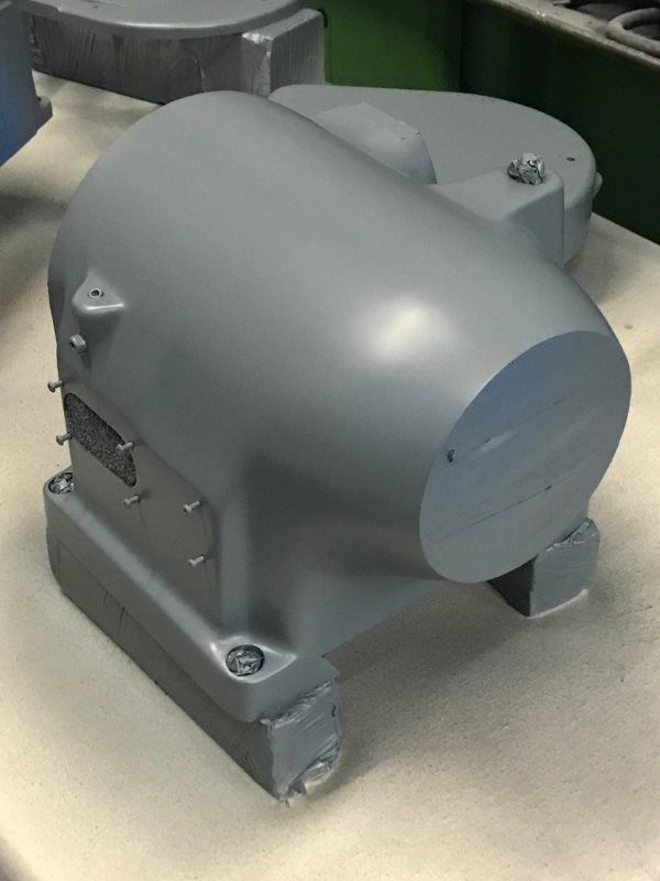 A large gray object is sitting on a table