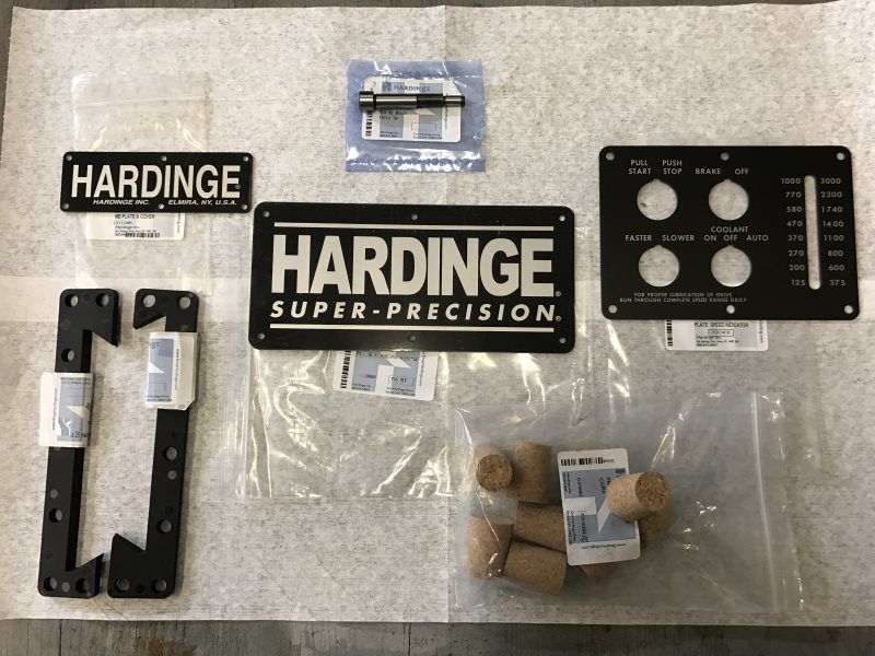 A bunch of hardinge super precision parts on a table