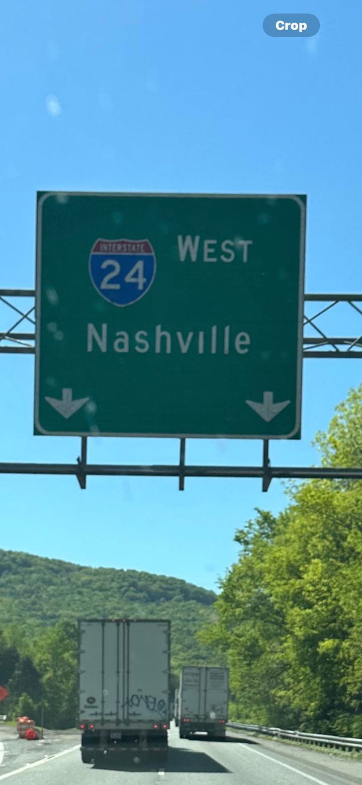 A highway sign that says interstate 24 west nashville