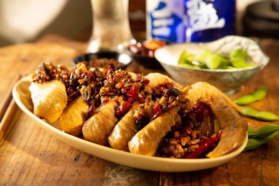 A plate of food is sitting on a wooden table.